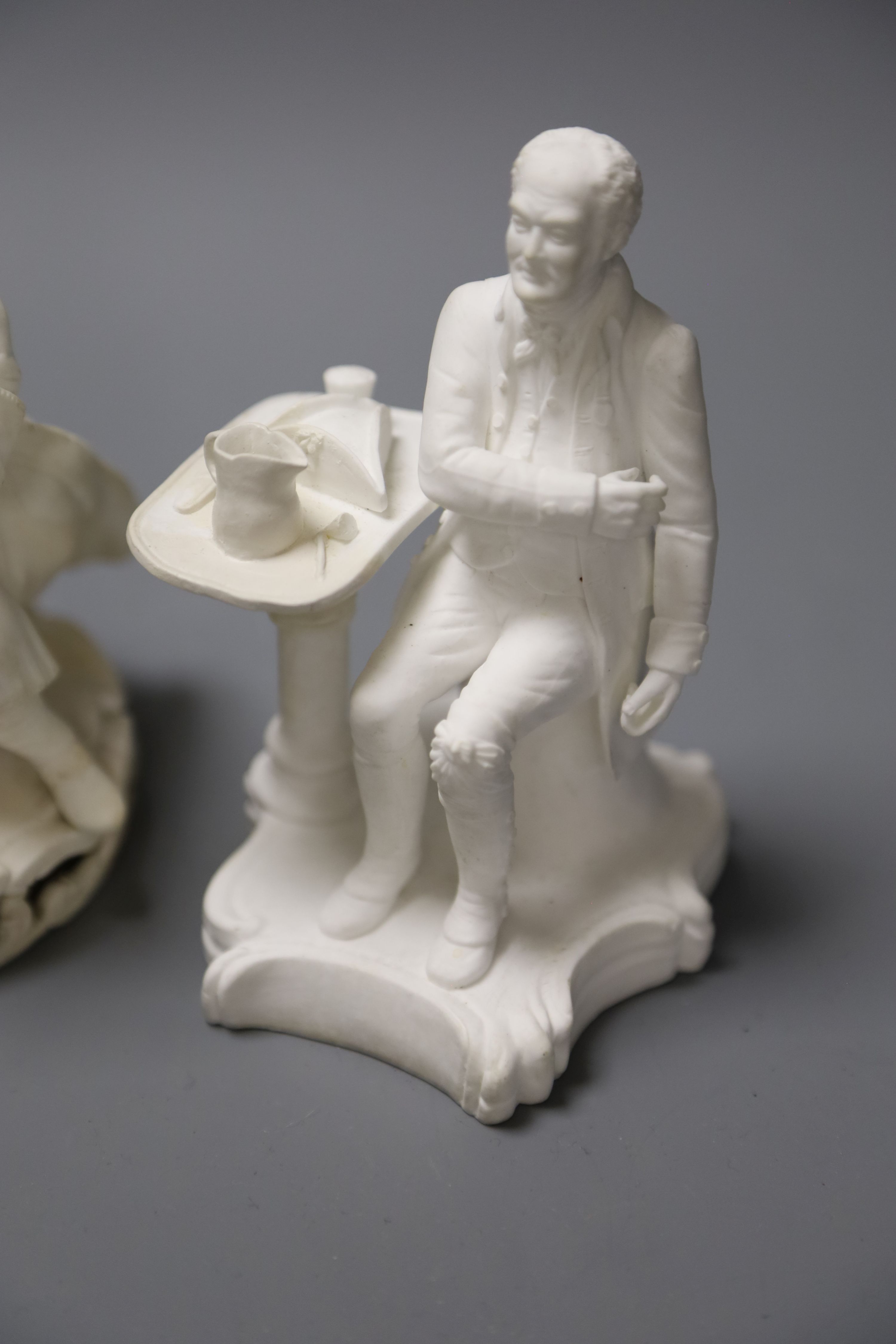 An early 19th century pair of Derby biscuit figures of a boy with a cat and a girl with a dog and a Minton figure of a Chelsea pensione